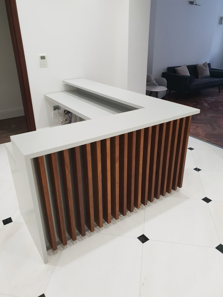 a white counter top sitting in the middle of a room