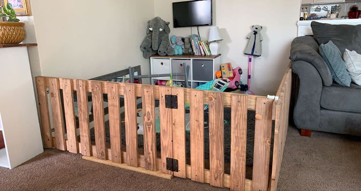 a living room filled with furniture and a flat screen tv mounted to the side of a wall