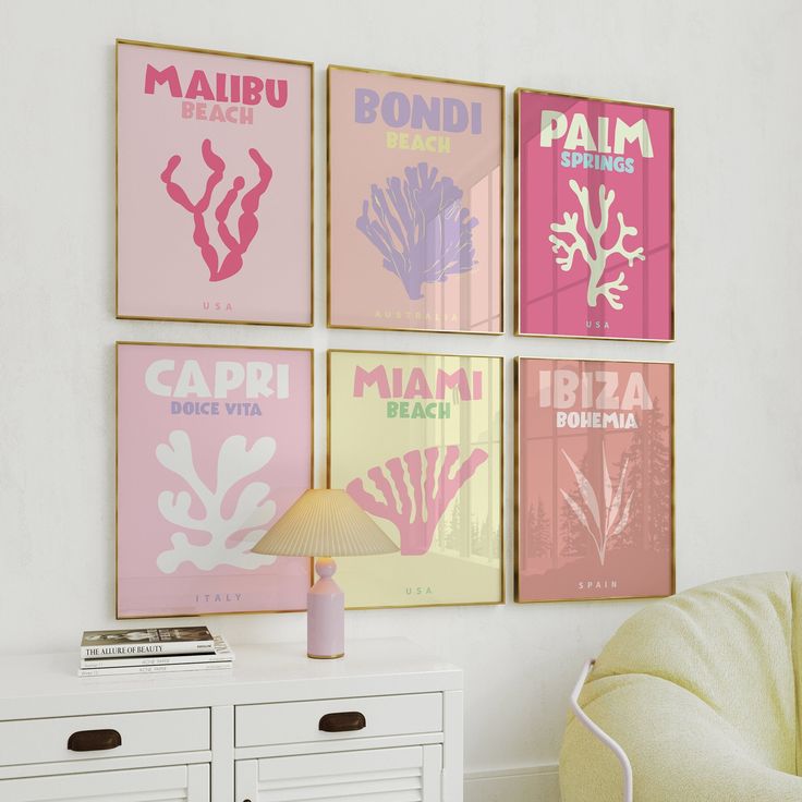 four pink and yellow posters hang on the wall above a white dresser in a living room