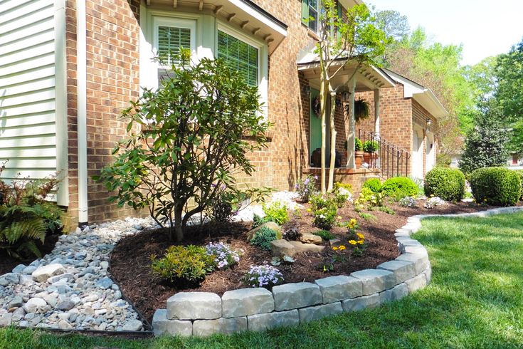 the front yard is clean and ready to be used as a flower bed or planter