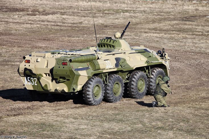 an army vehicle parked in the middle of a field