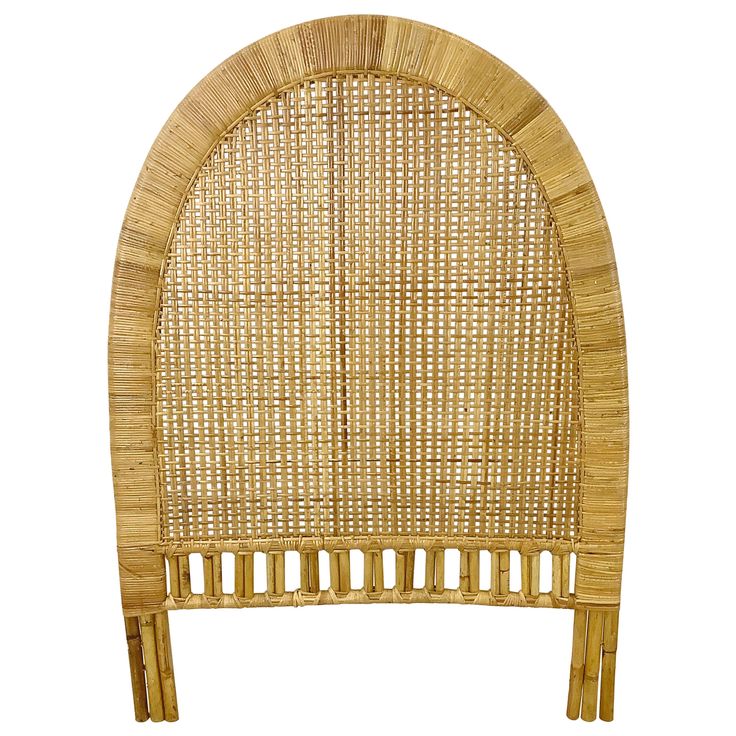 a wicker headboard made out of wood and rattan with an arched top