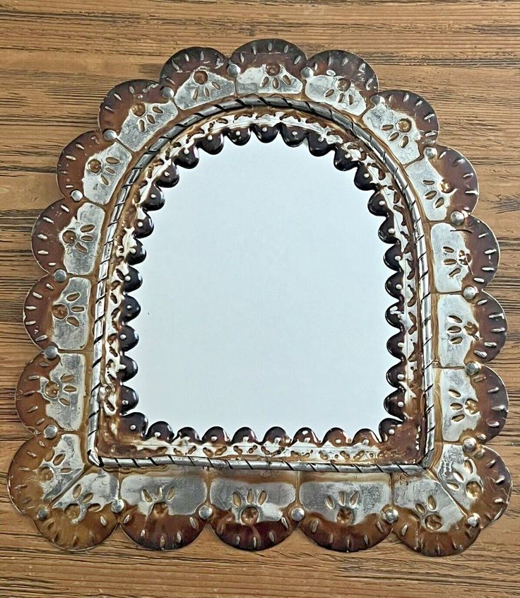 a mirror that is on top of a wooden table