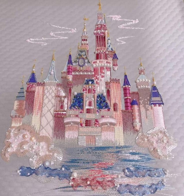 this is an image of a castle made out of sequins and beads on fabric