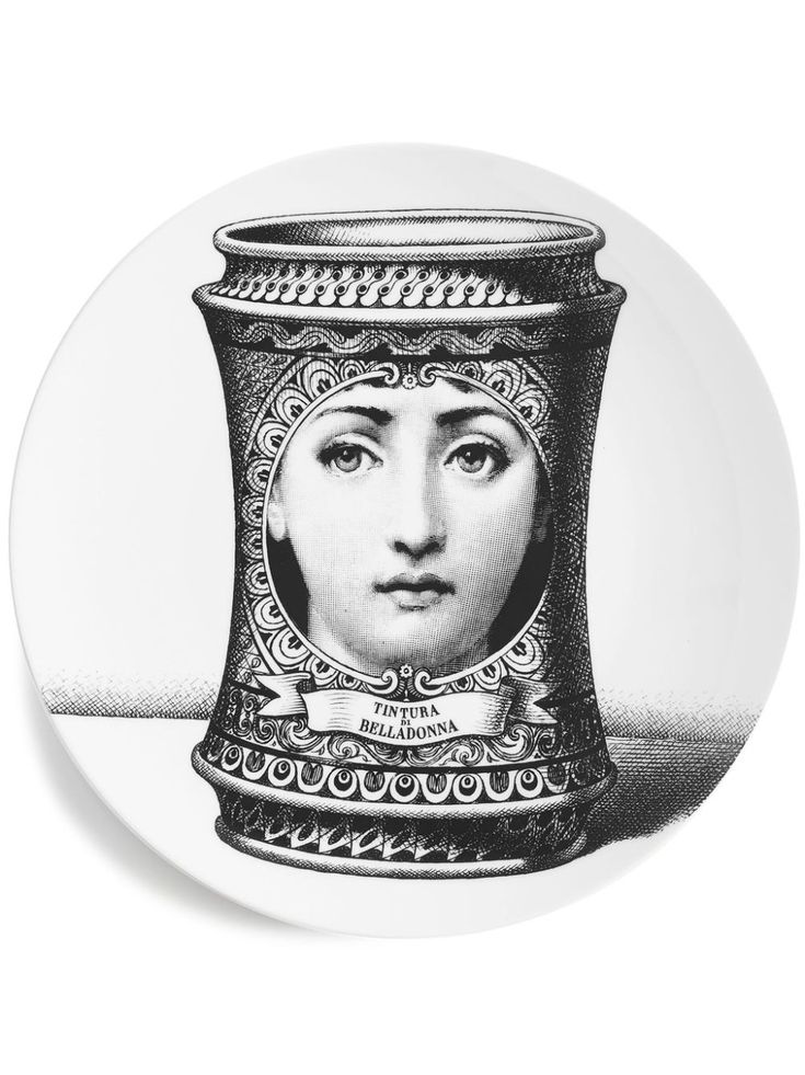 a black and white drawing of a woman's face in a pot on a plate