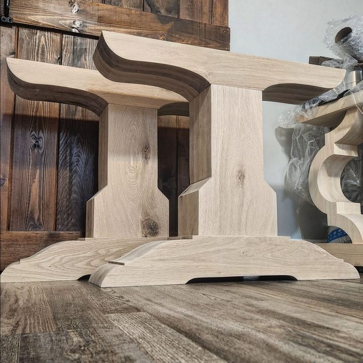 several pieces of wood sitting on top of a wooden table