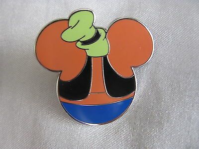 a mickey mouse pin with an orange and blue hat on it's head,