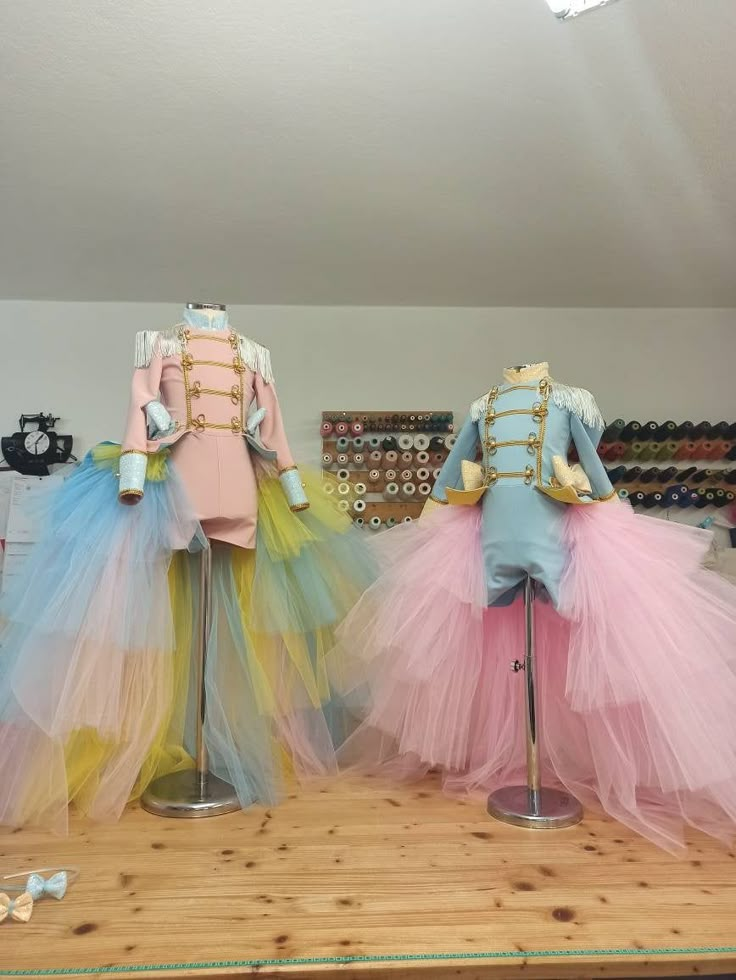 two mannequins dressed in colorful tulle skirts