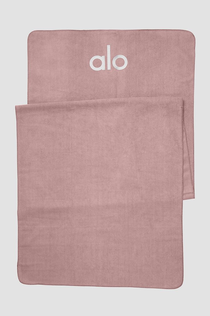 two towels with the word alo printed on them, one in pink and one in white