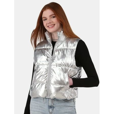 The No Boundaries Metallic Puffer Vest is like a blast from the past with a touch of futuristic flairthink neon lights and retro vibes rolled into one chic package. We love that you can cinch your waist with the adjustable toggle hems and wear it open or closed for endless styling options. The high neck collar will help keep you warm and the handy welt pockets are perfect to stash your essentials. Throw this puffer vest over any of your basics for an effortlessly cool girl look. Only at Walmart. Puffer Vest Fashion, Sleeveless Puffer, Quilted Puffer Vest, Green Vest, Leopard Print Scarf, Judas Priest, Vest White, Vest Fashion, Casual Fit