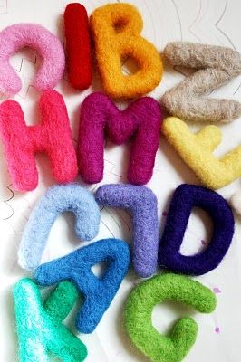 colorful felt letters laid out on top of each other