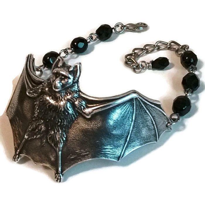 This cute bat bracelet was created using jet black Czech glass beads and antiqued silver plated brass!  They are a classic old school gothic style lovingly hand made by a genuine old school goth! ~ Jet black glass beads  ~ Metal components are antiqued silver brass ~ Bracelet measures 7-9 inches around with an extender chain VEXED JEWELRY: ONE-OF-A-KIND HANDCRAFTED PIECES MADE WITH LOVE, CARE, EXPERTISE & TOP QUALITY MATERIALS Gothic Silver Bracelets For Halloween, Silver Gothic Bracelets For Halloween, Adjustable Gothic Gunmetal Jewelry, Old School Goth, Bat Bracelet, Gothic Glasses, Halloween Beads, Cute Bat, Beaded Cuff Bracelet