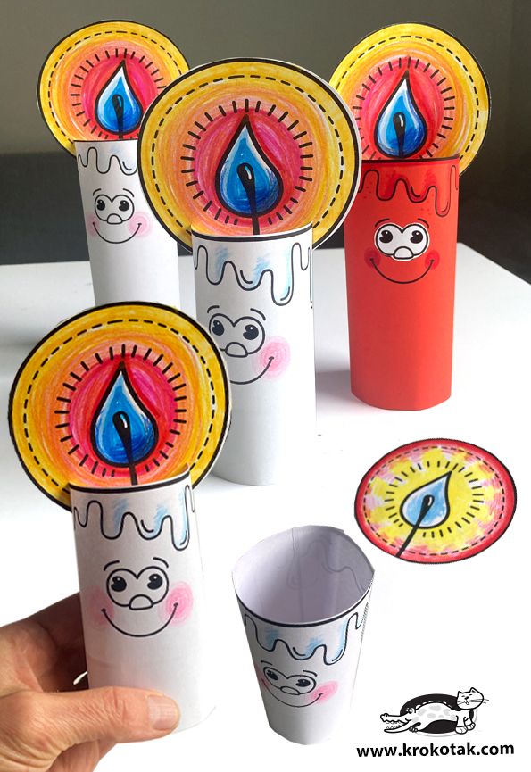 the paper cups have faces on them and are painted with different colors, shapes and designs