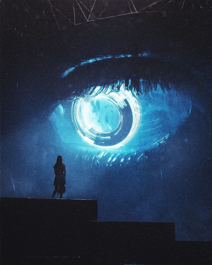 a person standing on a ledge in front of an eyeball with blue light coming from it