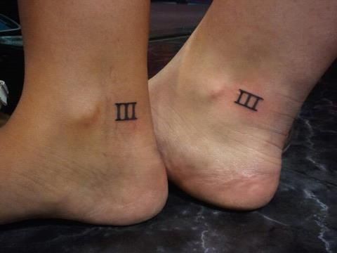 two people with small tattoos on their feet