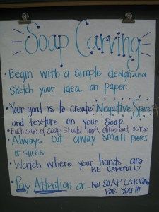 a sign that is posted on the side of a door saying soap carving begin with a simple design