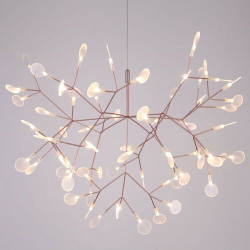 a chandelier with lights hanging from it's branches in the shape of a snowflake