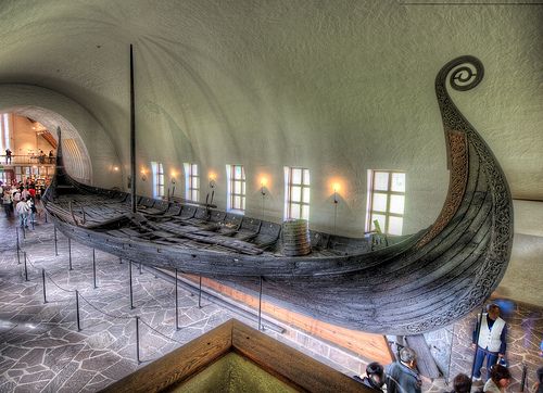 an old boat is on display in a museum