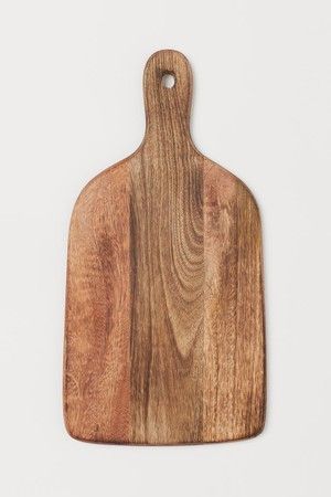 a wooden cutting board on a white background, with the wood grained surface visible