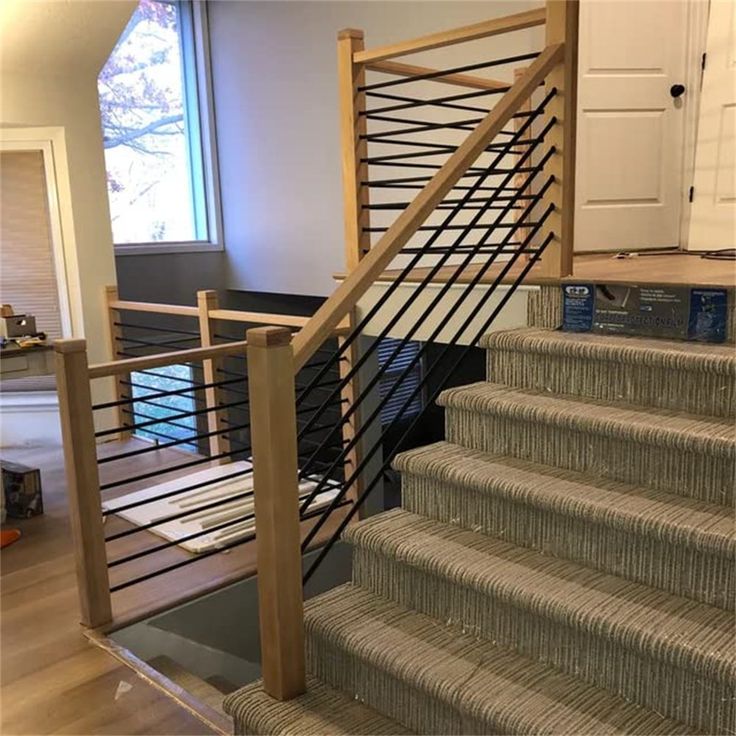 the stairs are made of wood and have metal handrails