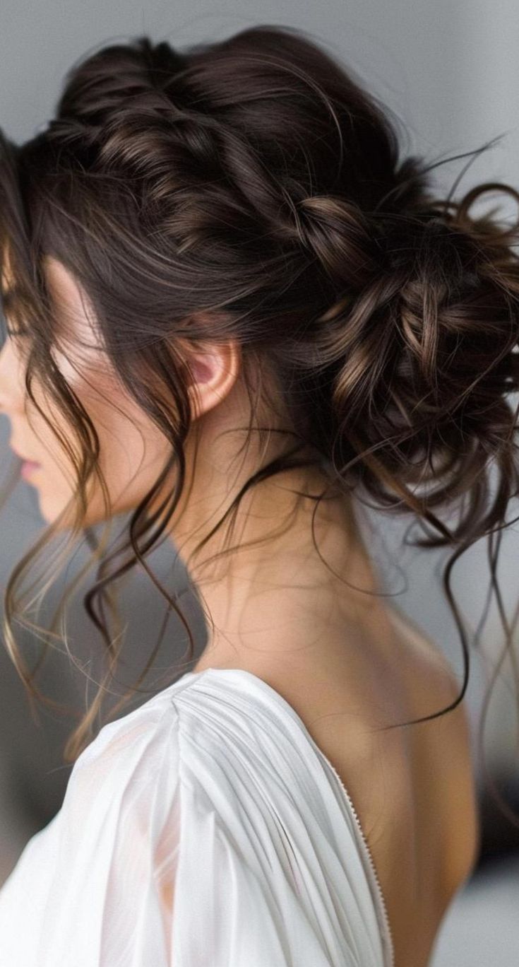 a woman with her hair in a messy updo