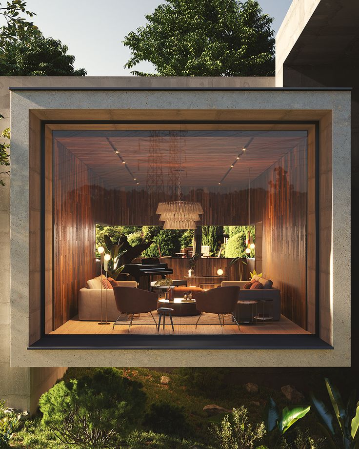 an open living room and dining area in a house with wood paneling on the walls