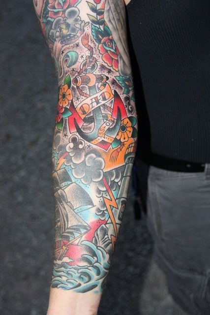 a man with a tattoo on his arm