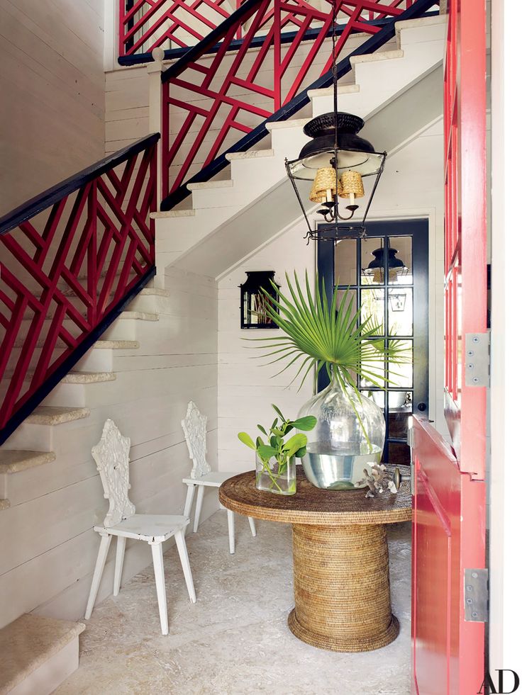 an image of a room with chairs and a table on the bottom floor in front of stairs