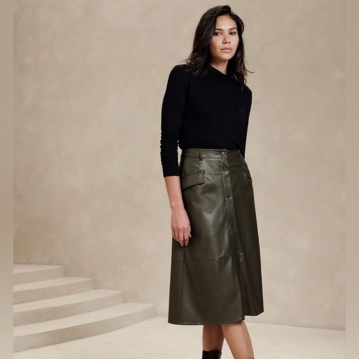 -Vegan Leather Skirt, Size S, In Olive Green Color -Lightweight, Smooth And Soft -Button Front Closure -Belt Loops -Front Pockets -Waist Darts - High Waist -Full Hem -Fully Lined -Base Fabric: 100% Rayon -Outer Coating:Polyruethane Hunter Green Leather Skirt, Green Leather Skirt Outfit, Midi Leather Skirt Outfit, Leather Midi Skirt Outfit, Classy Grandma, Midi Leather Skirt, Wardrobe Hacks, Green Leather Skirt, Fall 2023 Outfits