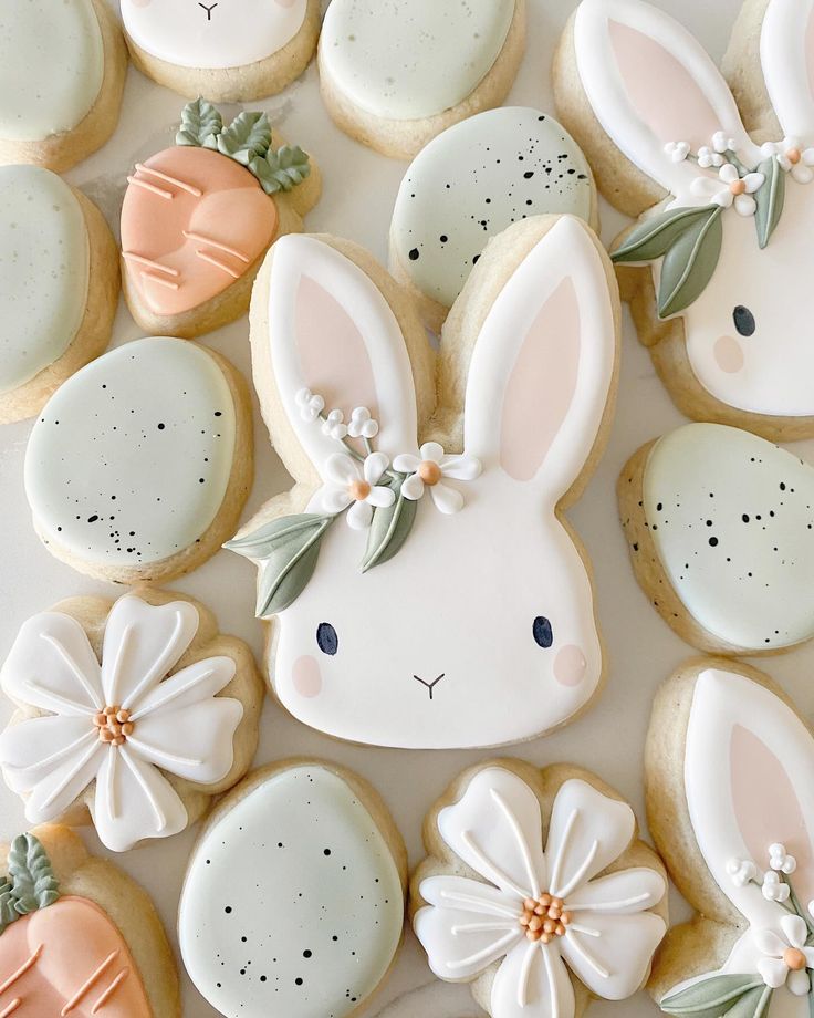 decorated cookies with bunny ears and flowers on them