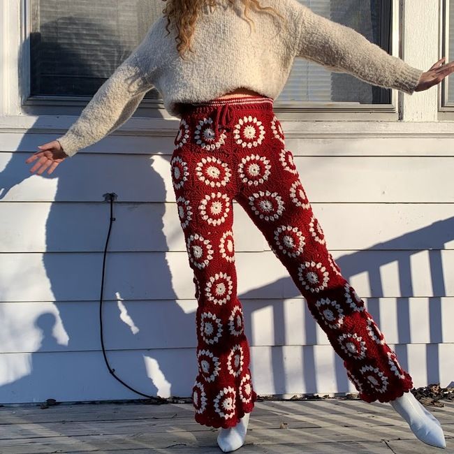 a woman is standing on the porch with her arms outstretched