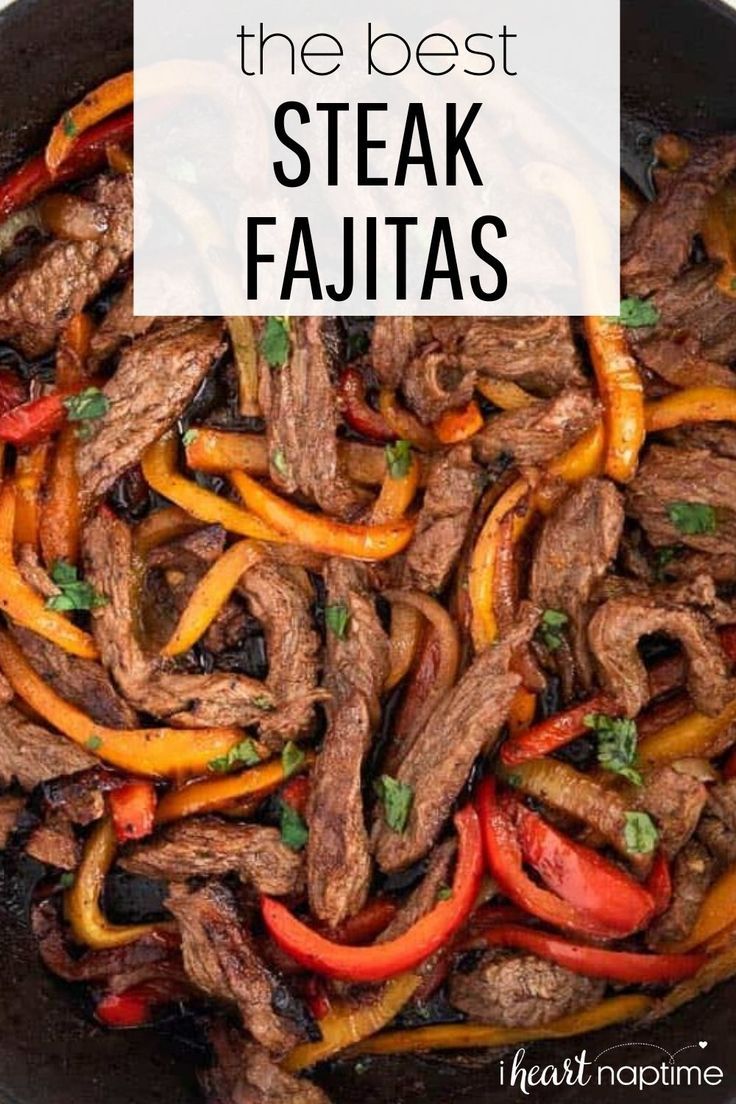 steak fajitas with peppers and onions in a skillet