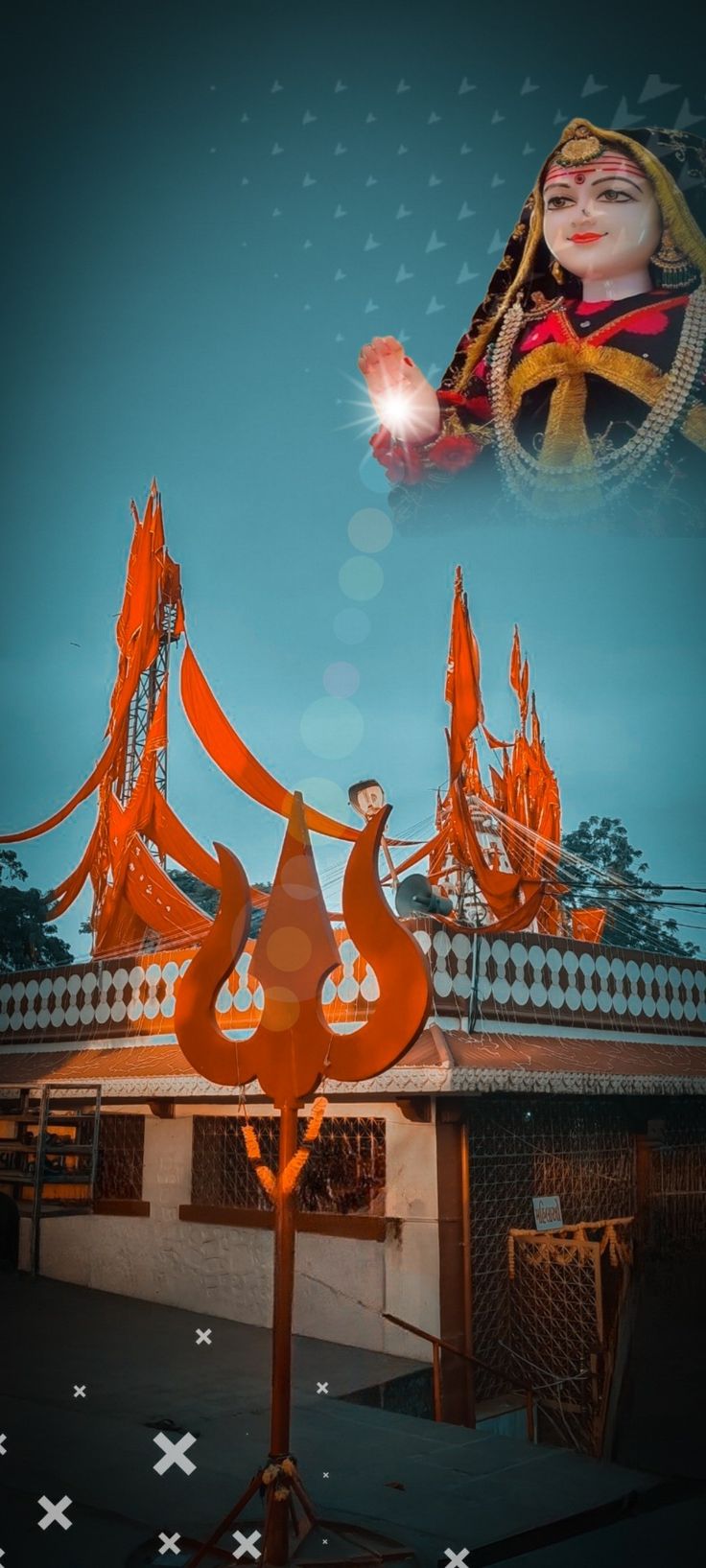 an artistic image of a woman holding a lit candle in front of a building with orange flags on it