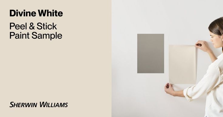 a woman holding up a piece of art on a wall with the words divine white peel & stick paint sample