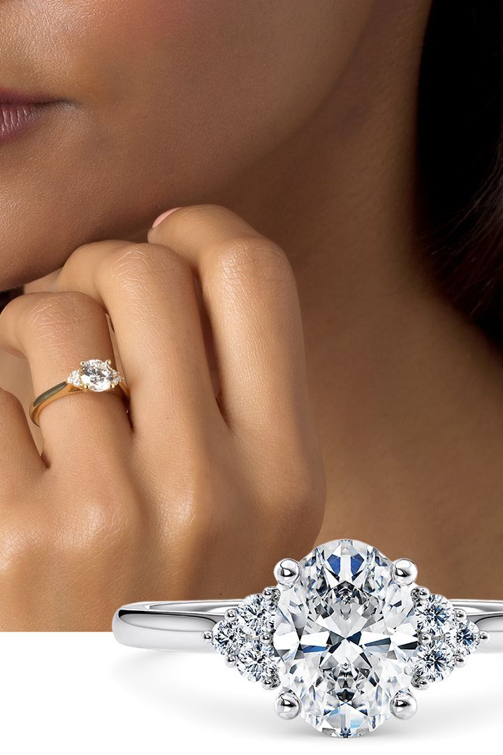 a woman's hand with a diamond ring on her finger