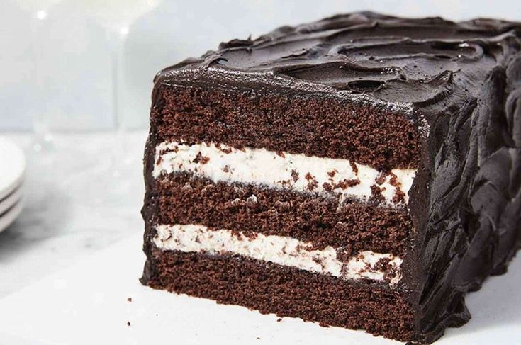 a slice of chocolate cake with white frosting