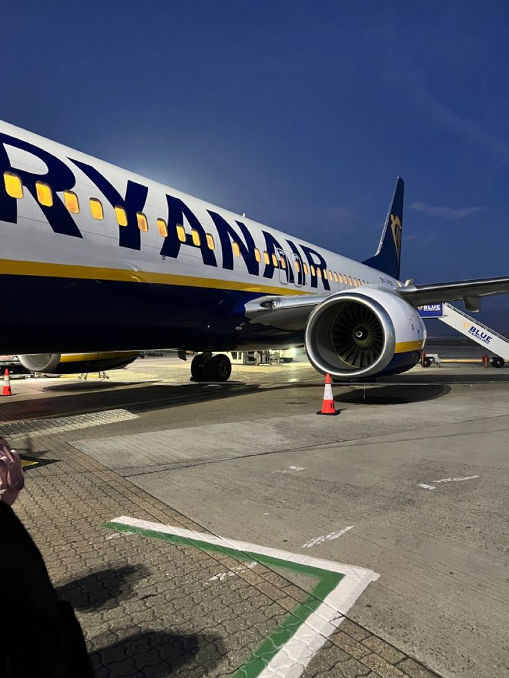 a large jetliner sitting on top of an airport tarmac