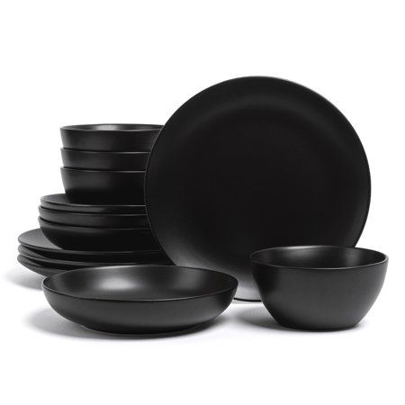 black dinnerware is stacked on top of each other