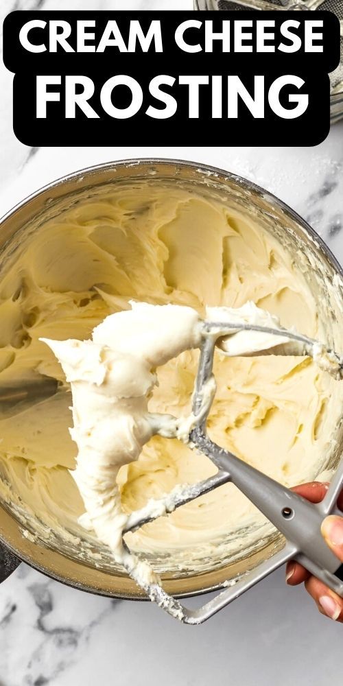 a hand holding a mixer with cream cheese frosting in it and text overlay that reads, how to make homemade cream cheese frosting