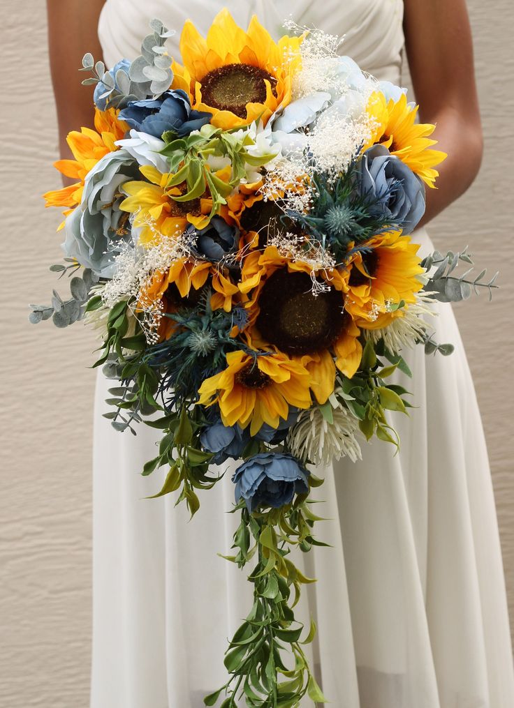 a bridal bouquet with sunflowers and succulents