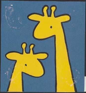 two giraffes standing next to each other in front of a blue background