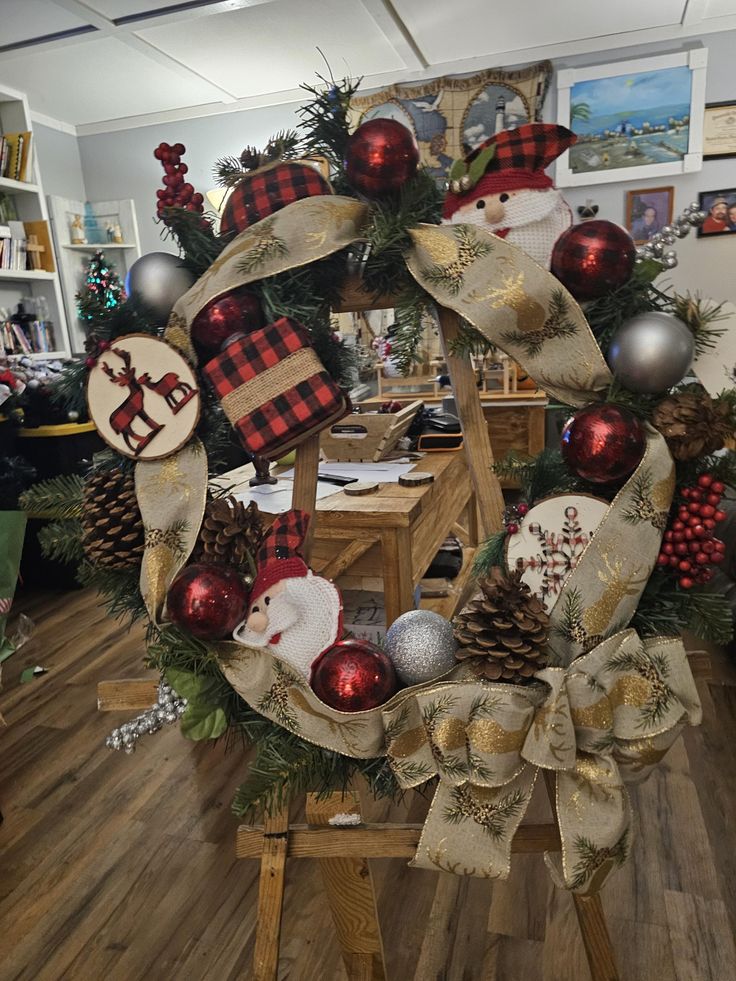 a christmas wreath with ornaments and decorations on it