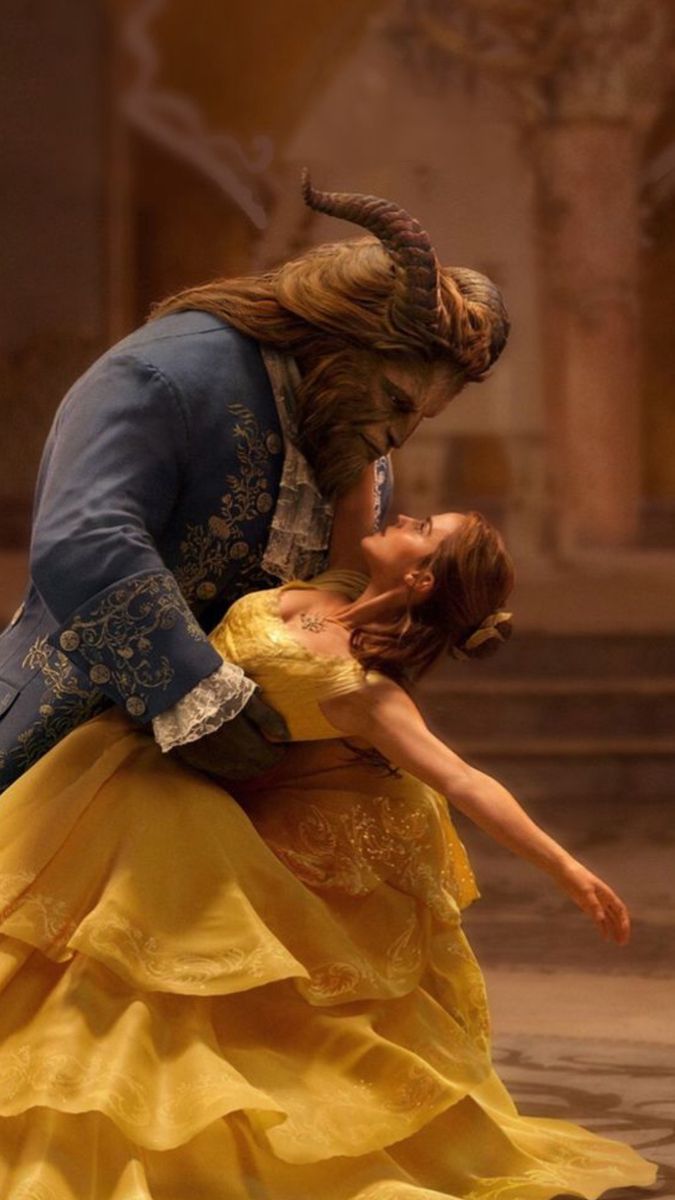 beauty and the beast dance together on stage