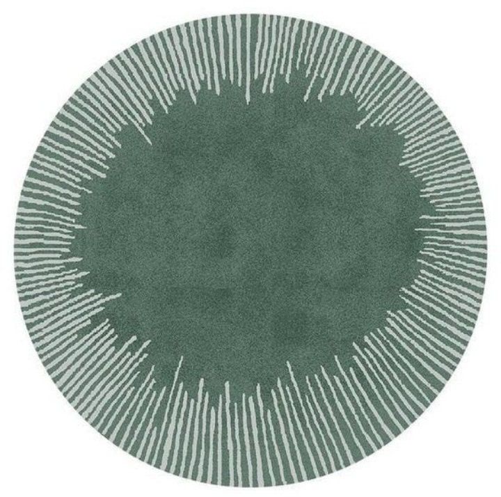 a green rug with white lines on the center and bottom, in an oval shape