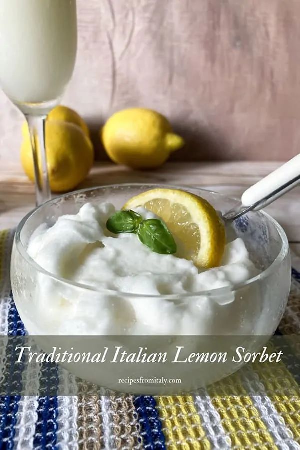 a glass bowl filled with lemon and whipped cream