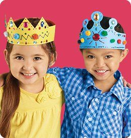 two young children wearing crowns on their heads