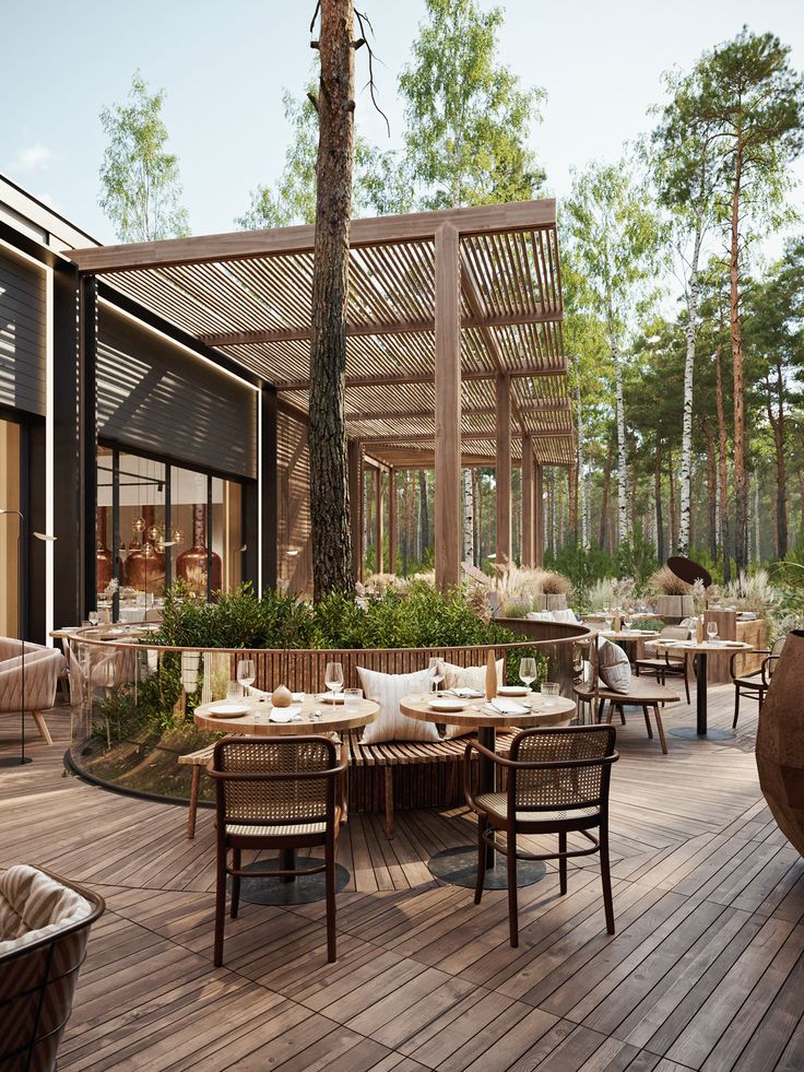 an outdoor dining area with wooden tables and chairs