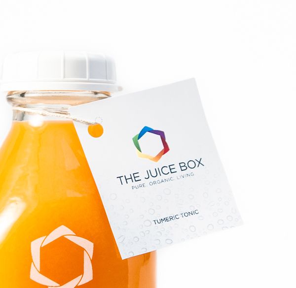 a bottle of juice with a label on the top that says, the juice box