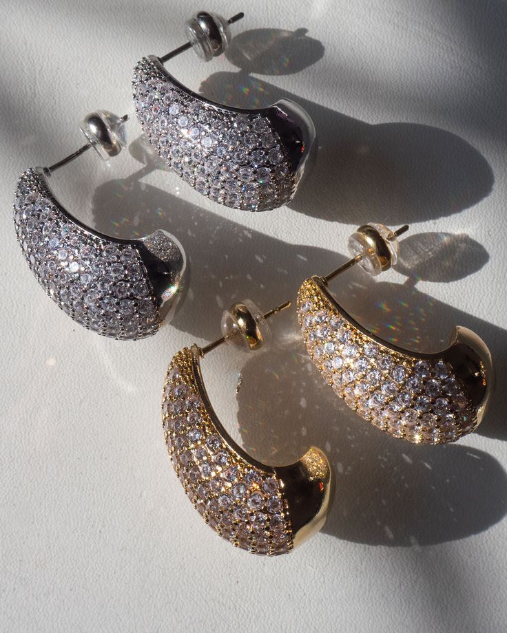 Chunky hollow push back curved bean-shaped pave earrings Sold as a pair for pierced ears Earrings are 25mm x 14mm Earrings are 9.8mm tall Earring weighs 5 grams per stud Earrings come with a push back Made from Brass with CZ Stones Plated Gold or Silver Posts are made from surgical steel so they are very hypo-allergenic for sensitive ears Earrings are 100% nickel-free and cadmium-free 1 year warranty Packaged in Luv Aj branded gift boxes Personalised Jewellery Necklaces, Sensitive Ears Earrings, Ears Earrings, Pave Earrings, Stone Plate, Luv Aj, Ear Earrings, Diamond Shop, Jewelry Case