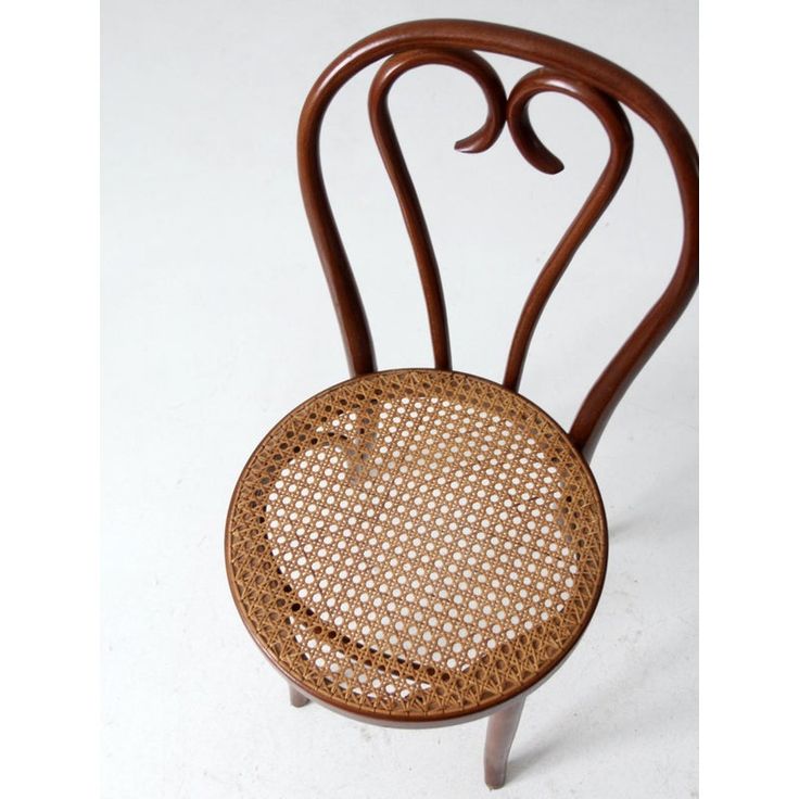 This is a vintage bentwood cafe chair circa 1940s-1960s.  Made in Romania, the classic art nouveau, Thonet style bistro chair has a caned seat. This bentwood chair is a fantastic mix of organic simplicity and artful sophistication. Seagrass Dining Chairs, Cafe Chair, Steel Dining Chairs, Blue Dining Chair, Bentwood Chairs, Made In Romania, Bistro Chairs, Cafe Chairs, Velvet Dining Chairs